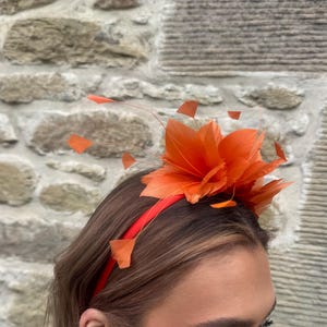 Rust feather fascinator on fine headband