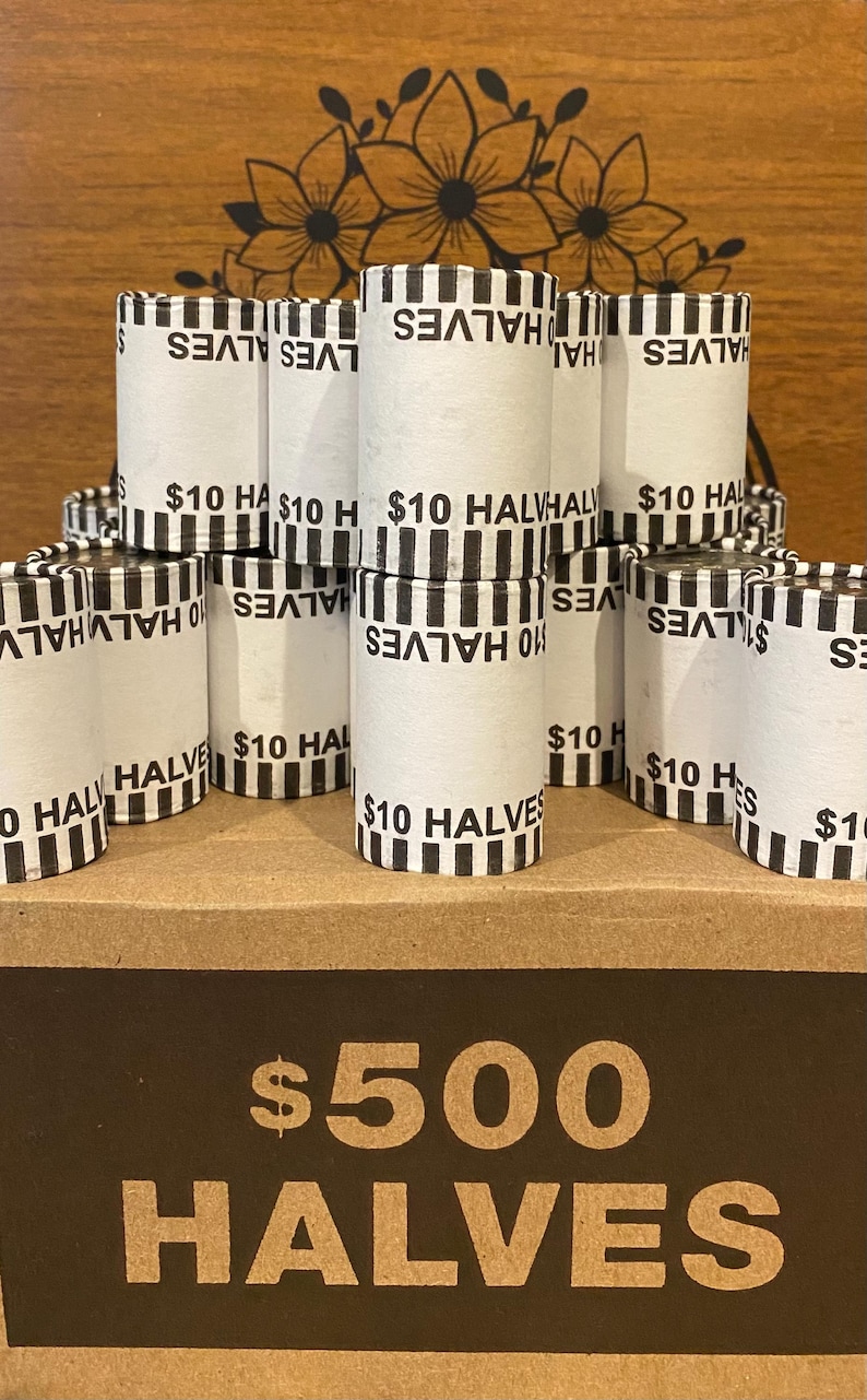 May include: A collection of rolled coin wrappers labeled "$10 Halves" and a cardboard box marked "$500 Halves." The wrappers are white with black text and stripes. The box is brown with large, bold lettering.