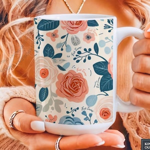 May include: White ceramic mug with a floral pattern in shades of pink, blue, and cream. The design includes roses and leaves, with the phrase "Fuck Trump" repeated throughout. The mug has a white handle.