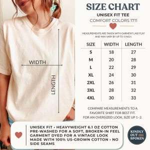 May include: A cream-colored short-sleeve t-shirt with a size chart graphic. The chart lists sizes S through 4XL with corresponding width and length measurements in inches. Text includes Comfort Colors 1711, 6.1 oz cotton, and US-grown cotton.