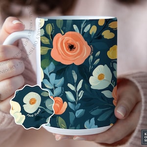May include: A white ceramic mug featuring a dark teal background with a repeating floral pattern of peach and cream-colored flowers and green leaves. The text "Fuck Trump" is printed in small, subtle lettering throughout the floral design.