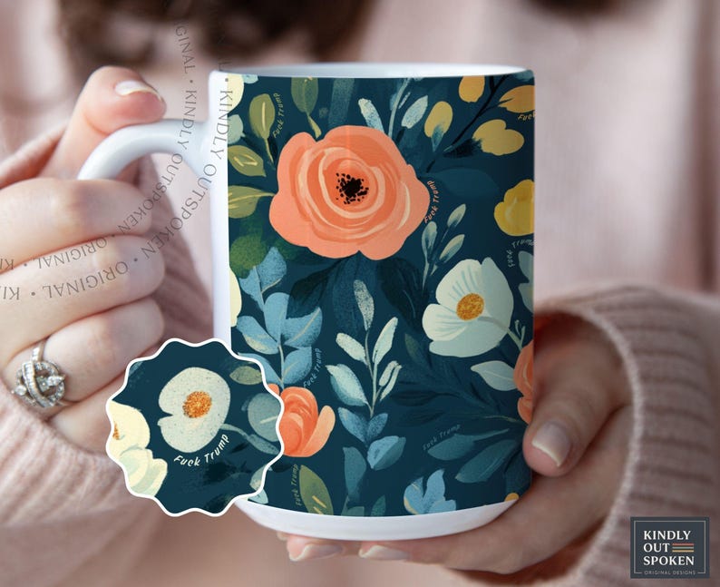 May include: A white ceramic mug featuring a dark teal background with a repeating floral pattern of peach and cream-colored flowers and green leaves. The text "Fuck Trump" is printed in small, subtle lettering throughout the floral design.