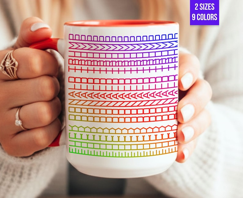 May include: White ceramic mug with a red interior and handle, featuring a colorful pattern of geometric shapes. The mug has the text "2 SIZES 9 COLORS" in a purple box.