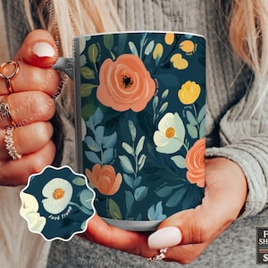 May include: A ceramic mug featuring a dark teal background with a floral pattern of peach, yellow, and cream-colored flowers and green leaves. The text "Fuck Trump" is printed in small letters throughout the floral design on the mug surface.