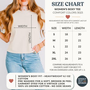 May include: A beige boxy t-shirt with a size chart graphic. The chart lists sizes S through 2XL with corresponding widths and lengths in inches. Text includes 'Women's Boxy Tee Comfort Colors 3023', '100% US Grown Cotton', and 'Heavyweight 6.1 oz'.