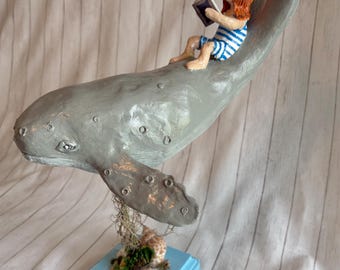 Humpback Whale with Girl reading a Book on Back
