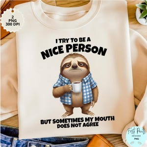 May include: Cream-colored sweatshirt with a graphic of a grumpy sloth holding a coffee cup. The text reads "I try to be a nice person, but sometimes my mouth does not agree."