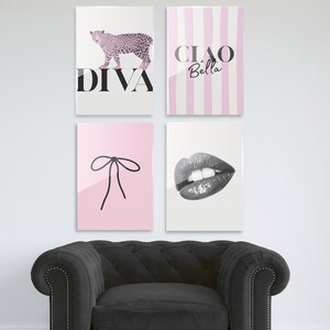 May include: Four wall art prints. One features a pink leopard with the word "DIVA". Another has pink and white stripes with the words "CIAO Bella". A third shows a black bow on pink. The last is a grayscale image of lips.