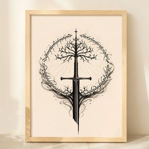May include: Framed art print featuring a black and white illustration of a sword with a tree design, encircled by text. The artwork is set against a cream background, framed in light wood.
