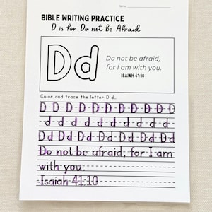 May include: A white Bible writing practice sheet with the text "BIBLE WRITING PRACTICE D is for Do not be Afraid". The sheet includes the letter D, the phrase "Do not be afraid, for I am with you", and the scripture reference Isaiah 41:10.