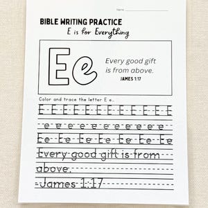 May include: A white Bible writing practice sheet with the text "BIBLE WRITING PRACTICE E is for Everything." The sheet includes the letters "E e" and the phrase "Every good gift is from above." Lines are provided for tracing the letters.