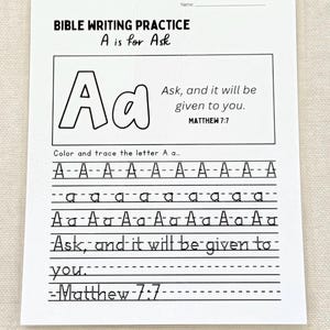 May include: A white Bible writing practice sheet with the text "BIBLE WRITING PRACTICE A is for Ask". The sheet includes the letter "A" in uppercase and lowercase, with lines for tracing and the Bible verse Matthew 7:7.
