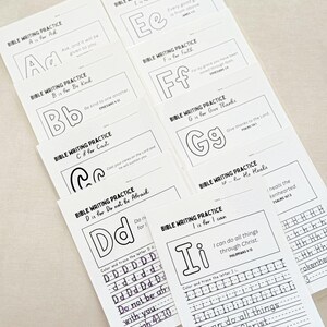 May include: A collection of white Bible writing practice sheets. Each sheet features a letter of the alphabet, a corresponding Bible verse, and lines for tracing. The sheets are designed for coloring and tracing, promoting scripture learning.
