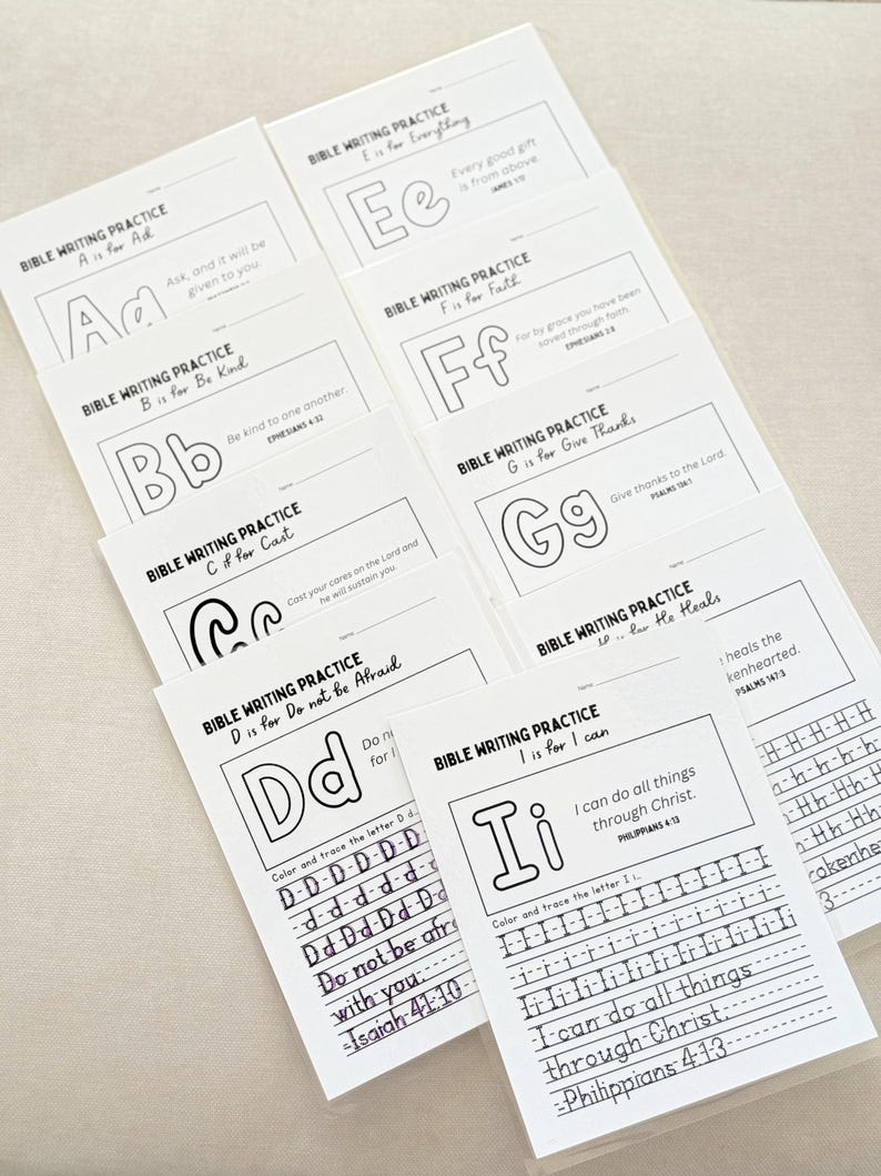 May include: A collection of white Bible writing practice sheets. Each sheet features a letter of the alphabet, a corresponding Bible verse, and lines for tracing. The sheets are designed for coloring and tracing, promoting scripture learning.