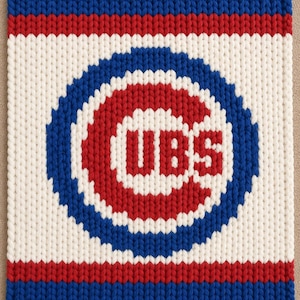 May include: A rectangular knitted blanket featuring the Chicago Cubs logo in red, white, and blue. The design includes a central red 'CUBS' text inside a white circle, surrounded by a thick blue ring, set against a white background with red and blue stripes.