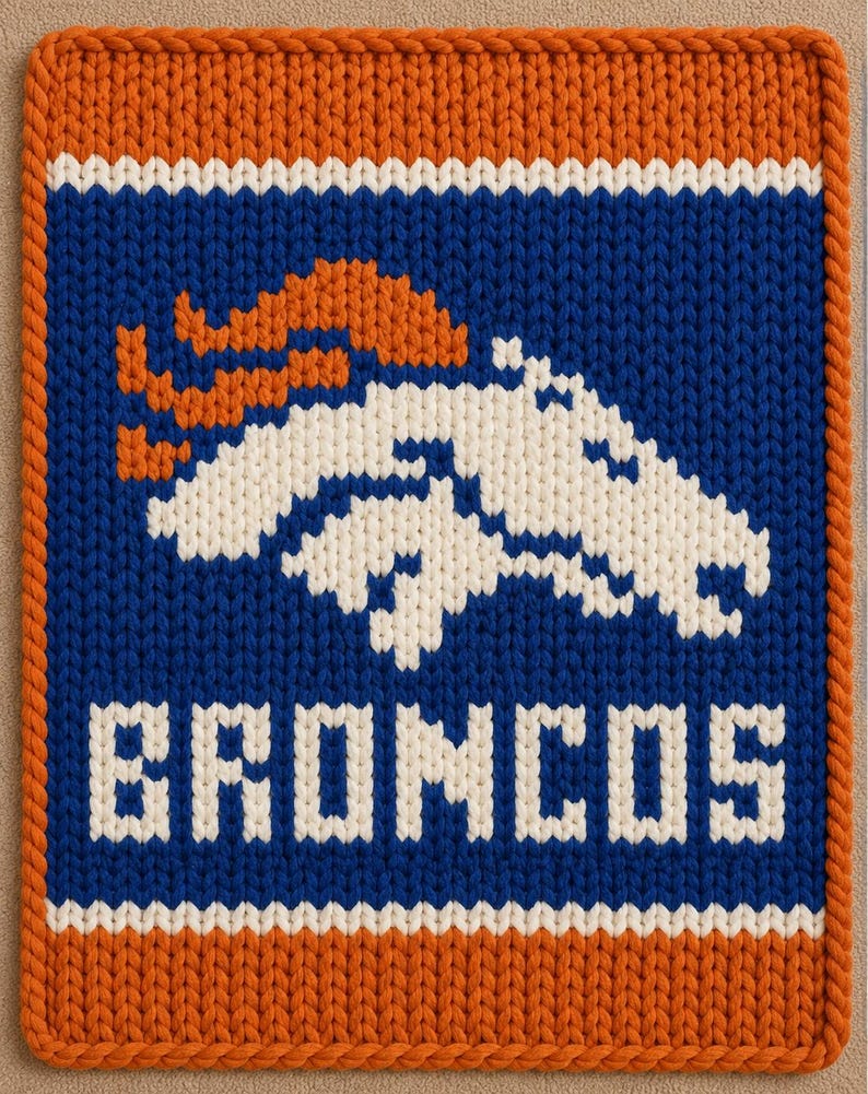 May include: A rectangular knitted wall hanging featuring the Denver Broncos logo in white and orange on a blue background. The design includes the word BRONCOS in white block letters below the horse head emblem, all bordered by a thick orange rope trim.