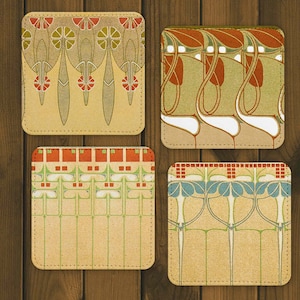 May include: Four square coasters with a vintage art nouveau design. The coasters feature intricate patterns in shades of green, red, blue, and white on a beige background.