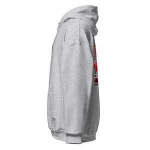 May include: A light grey hoodie with a front pocket and a hood. The side view reveals a red graphic on the right side. The hoodie is made of a soft material.