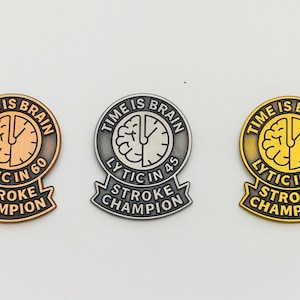 May include: Three metal pins with the text "TIME IS BRAIN" and "LYTIC IN" followed by a number, and "STROKE CHAMPION". The pins are bronze, silver, and gold, each with a clock face design and a brain graphic.