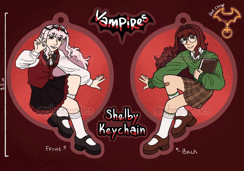 May include: A double-sided Shelby keychain featuring a cartoon vampire character. The front shows a character in a red and black outfit, while the back depicts a character in a green sweater and plaid skirt. The keychain is 8.89 cm in height.