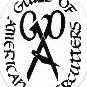 May include: Black and white logo of the Guild of American Paper Cutters. The logo features a stylized pair of scissors with the letters "G" and "O" intertwined.