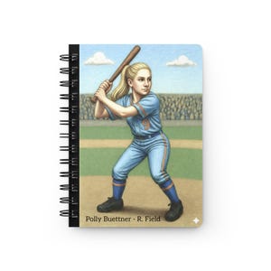 May include: Spiral-bound notebook featuring a baseball-themed illustration. The artwork depicts a woman in a blue uniform with the number 9, holding a bat. The background shows a baseball field and a crowd. Text at the bottom reads "Polly Buettner - R. Field."