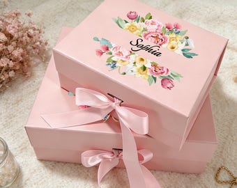 Caja de regalo magnética personalizada con cinta y diseño floral.
