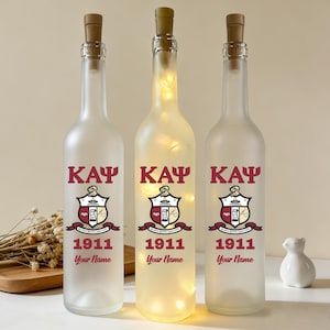 May include: A set of three ceramic nesting bowls in shades of blue, green, and white. The bowls feature a speckled glaze and a simple, modern design. The largest bowl measures approximately 6 inches in diameter.