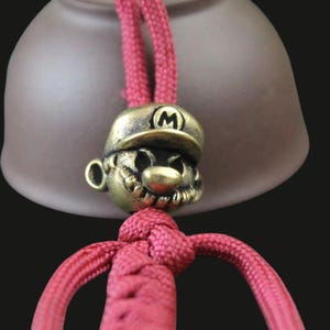 Cuenta de latón para paracord, cuenta EDC con personaje de dibujos animados, cuenta para cordón de cuchillo, dije para llavero, accesorio de paracord para manualidades.
