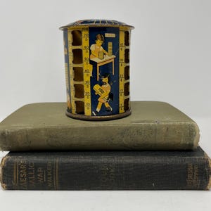 Child’s tin coin bank, vintage