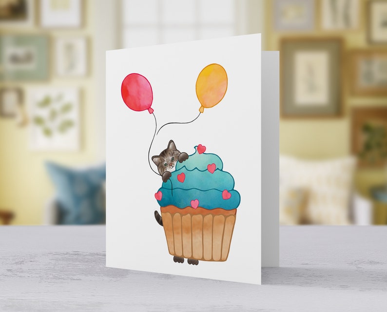 Brown Tabby Cat, Birthday Card Show some love with a sweet Tabby Cat peeking out from behind a cupcake holding balloons. image 5