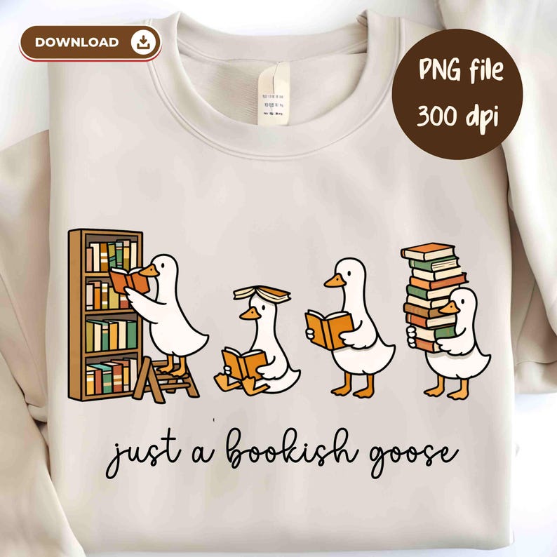 May include: Cream-colored sweatshirt featuring a whimsical illustration of four white geese engrossed in reading books. One goose is on a ladder, another has a book on its head, and the last is carrying a stack of books. The text "just a bookish goose" is below the illustration.