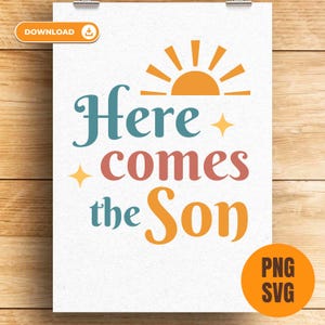 May include: A white poster with the words "Here comes the Son" in teal, coral, and orange. A yellow sun graphic is at the top. The poster is held by silver clips against a wood grain background.