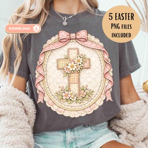 May include: Dark grey t-shirt with a floral cross design, a pink bow, and the text "5 Easter PNG Files Included". The cross is decorated with flowers and set within a decorative oval frame.