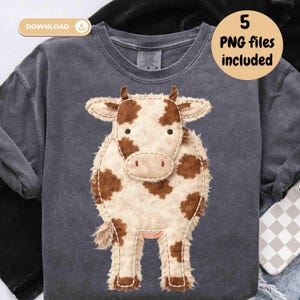 May include: A dark grey sweatshirt with a large appliqué cow design. The cow has a cream body with brown spots and a fringed edge. The text "5 PNG files included" is in a circle on the right side of the image.