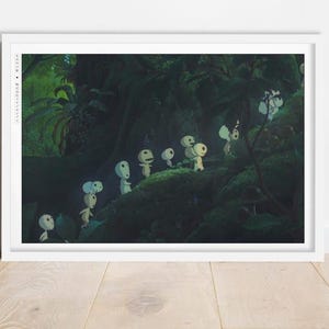 May include: A framed print depicting a forest scene with several small, white, humanoid figures with large, round heads. The figures are set in a dark, lush forest with green foliage.