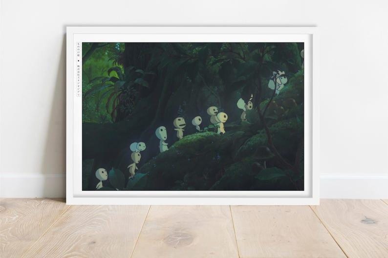 May include: A framed print depicting a forest scene with several small, white, humanoid figures with large, round heads. The figures are set in a dark, lush forest with green foliage.