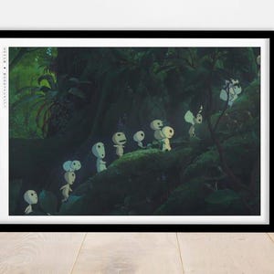 May include: A framed print depicting a forest scene with several small, white, humanoid figures with round heads. The figures are walking on a mossy surface, surrounded by lush green foliage. The print is in a black frame.