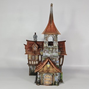 May include: A detailed miniature fantasy building with a tall steeple and multiple levels. The structure features a red tile roof, stone walls, and wooden accents. The building has a small arched doorway and several windows.