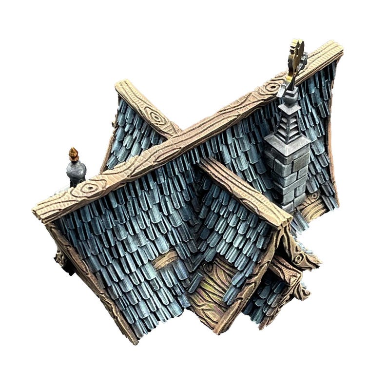 Puede incluir: Modelo en miniatura de un tejado con un dise&ntilde;o detallado. El tejado tiene tejas de color gris azulado, con vigas y molduras de madera. Tambi&eacute;n se ven una chimenea y un adorno decorativo. El modelo es probablemente para un juego de mesa o un diorama.