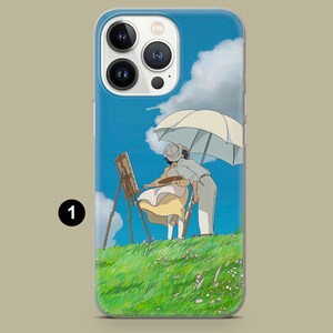 May include: A phone case featuring a scene of two people painting outdoors under a parasol. The artwork depicts a sunny day with a blue sky, white clouds, and a green grassy hill. The case has a clear border.