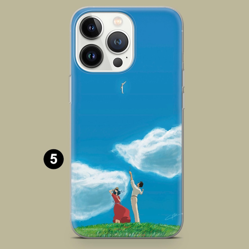 May include: A blue iPhone case featuring an illustration of a couple on a grassy hill, reaching towards a bird in a bright blue sky with fluffy white clouds. The woman wears a red dress.