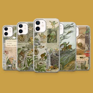 May include: A collection of five phone cases featuring illustrations of frogs and text from a children's book. The cases have a clear background and a glossy finish. The illustrations include frogs in various scenes, with text excerpts.