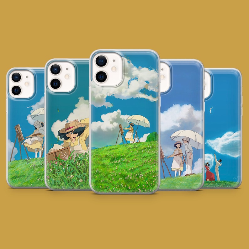 May include: A collection of phone cases featuring a serene landscape scene. Each case displays a vibrant blue sky with fluffy white clouds, green hills, and figures painting with easels and umbrellas. The cases are designed for a smartphone.