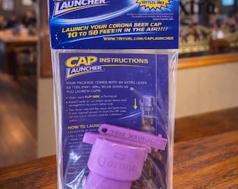 Corona Bottle Cap Launcher: Launches Caps 10-50 Feet, 12oz Bottles Only