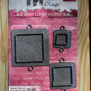 May include: A package of three square metal bezels with a decorative floral pattern. The bezels are in various sizes and have small loops for hanging. The package includes the text "Squares Two" and "Susan Lenart Kazmer".