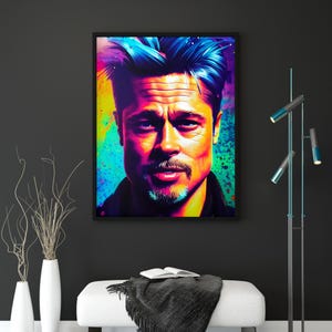 Può includere: Un ritratto pop art incorniciato di un uomo con i capelli blu e un pizzetto. L'opera d'arte utilizza colori vivaci, tra cui giallo, verde e viola, su uno sfondo nero. Il ritratto è appeso sopra una panca bianca con una coperta e un tappeto neri.