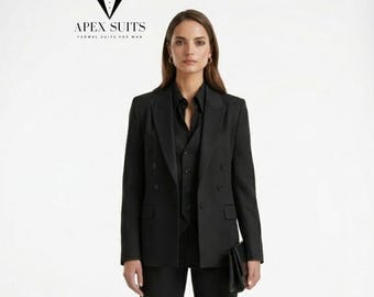 May include: A woman wearing a black formal suit, including a double-breasted blazer, vest, and trousers. The suit is paired with a black collared shirt. The Apex Suits logo is visible in the upper left corner.