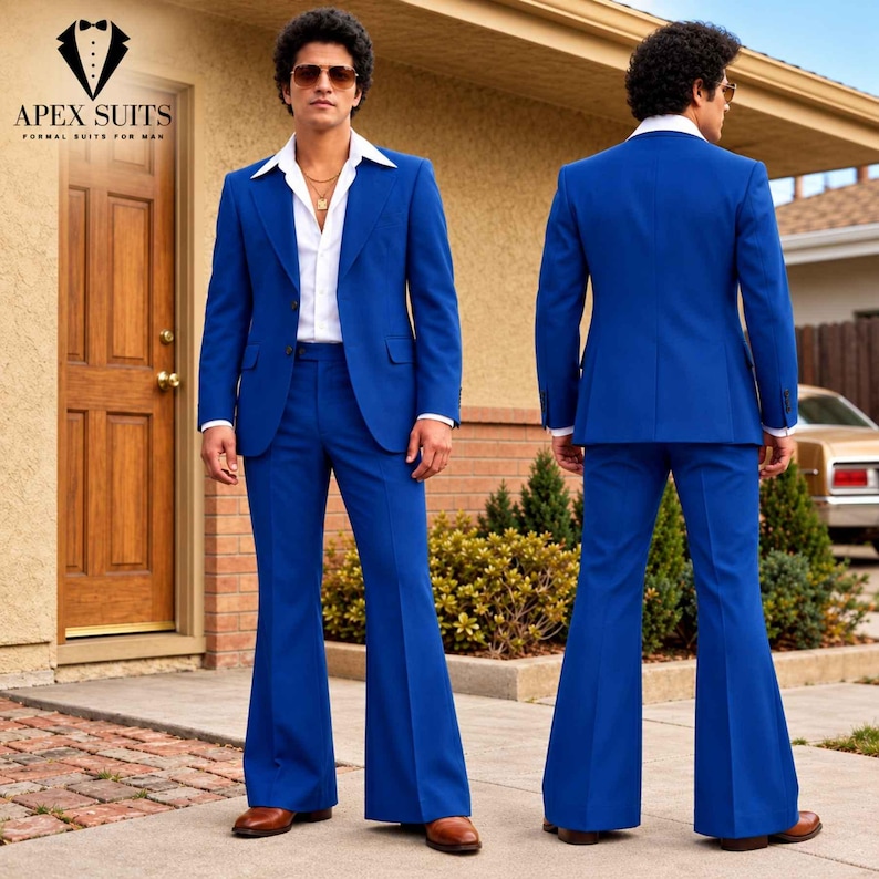 May include: A vibrant royal blue suit featuring a two-button blazer with wide lapels and matching flared trousers. The ensemble is paired with a crisp white button-down shirt, brown leather shoes, and gold-toned sunglasses.
