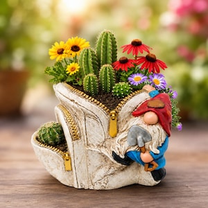 May include: A white, textured planter shaped like an open backpack with gold zippers, containing various green cacti and colorful yellow, red, and purple flowers. A small gnome figure with a red hat and blue shirt holds a shovel on the side.